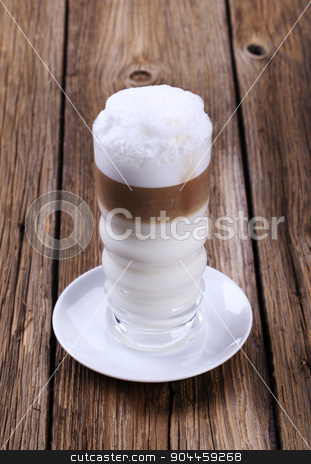 To use this stock image in your creative project, please select the size you need over to the right and click the "Add to Cart" button.
Your downloaded image will come with the Cutcaster watermark removed so don’t worry about the watermark you see on this page. Latte macchiato stock photo, Glass of Latte macchiato with milk foam by Digifoodstock