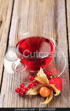 To use this stock image in your creative project, please select the size you need over to the right and click the "Add to Cart" button.
Your downloaded image will come with the Cutcaster watermark removed so don’t worry about the watermark you see on this page. Fruit tea stock photo, Fruit tea in a glass cup - closeup by Digifoodstock