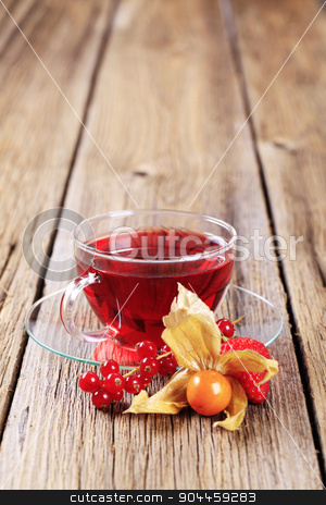 To use this stock image in your creative project, please select the size you need over to the right and click the "Add to Cart" button.
Your downloaded image will come with the Cutcaster watermark removed so don’t worry about the watermark you see on this page. Fruit tea stock photo, Fruit tea in a glass cup - closeup by Digifoodstock