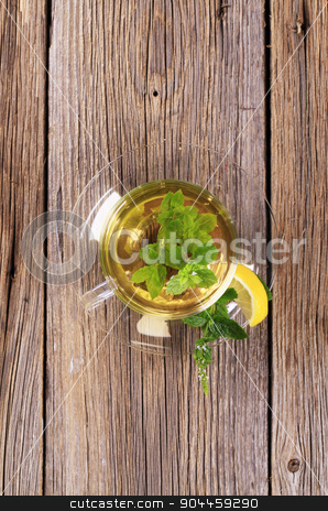 To use this stock image in your creative project, please select the size you need over to the right and click the "Add to Cart" button.
Your downloaded image will come with the Cutcaster watermark removed so don’t worry about the watermark you see on this page. Mint tea stock photo, Mint tea made of fresh mint leaves by Digifoodstock