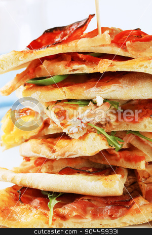 To use this stock image in your creative project, please select the size you need over to the right and click the "Add to Cart" button.
Your downloaded image will come with the Cutcaster watermark removed so don’t worry about the watermark you see on this page. Slices of pizza stock photo, Stack of thin slices of pizza - detail by Digifoodstock