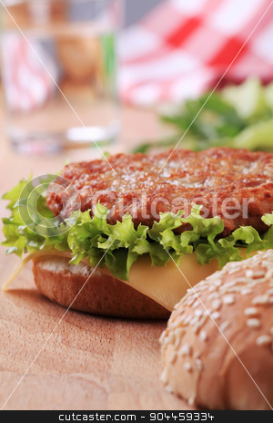 To use this stock image in your creative project, please select the size you need over to the right and click the "Add to Cart" button.
Your downloaded image will come with the Cutcaster watermark removed so don’t worry about the watermark you see on this page. Hamburger stock photo, Closeup of a Cheeseburger - ready to eat by Digifoodstock