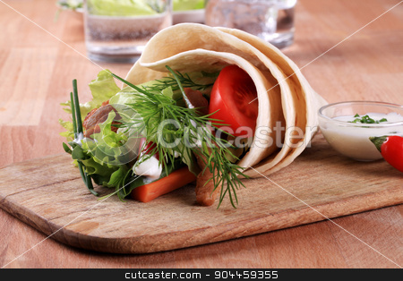 To use this stock image in your creative project, please select the size you need over to the right and click the "Add to Cart" button.
Your downloaded image will come with the Cutcaster watermark removed so don’t worry about the watermark you see on this page. Vegetarian wrap sandwich stock photo, Vegetarian wrap sandwich with textured vegetable protein by Digifoodstock