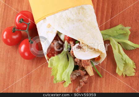 To use this stock image in your creative project, please select the size you need over to the right and click the "Add to Cart" button.
Your downloaded image will come with the Cutcaster watermark removed so don’t worry about the watermark you see on this page. Wrap sandwich stock photo, Tortilla filled with ground meat - closeup by Digifoodstock