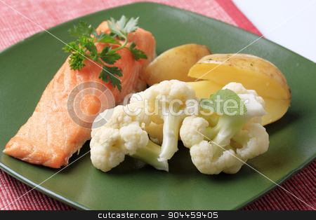 To use this stock image in your creative project, please select the size you need over to the right and click the "Add to Cart" button.
Your downloaded image will come with the Cutcaster watermark removed so don’t worry about the watermark you see on this page. Salmon fillet and vegetables stock photo, Oven-baked salmon fillet, potatoes and cauliflower by Digifoodstock