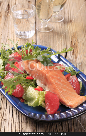 To use this stock image in your creative project, please select the size you need over to the right and click the "Add to Cart" button.
Your downloaded image will come with the Cutcaster watermark removed so don’t worry about the watermark you see on this page. Seared salmon with salad greens and red orange stock photo, Salmon fillet on a bed of fresh salad by Digifoodstock