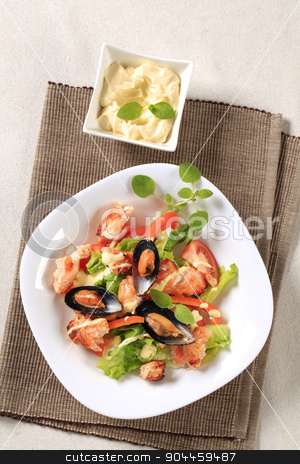 To use this stock image in your creative project, please select the size you need over to the right and click the "Add to Cart" button.
Your downloaded image will come with the Cutcaster watermark removed so don’t worry about the watermark you see on this page. Seafood salad stock photo, Seafood salad with pan fried salmon and mussels by Digifoodstock