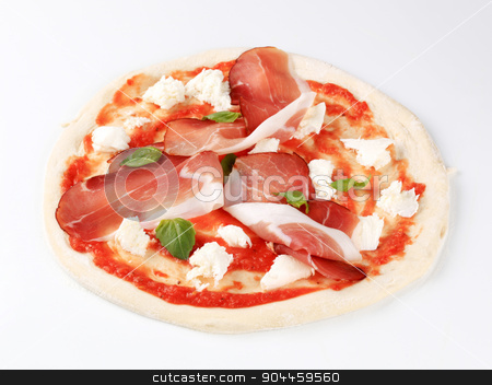 To use this stock image in your creative project, please select the size you need over to the right and click the "Add to Cart" button.
Your downloaded image will come with the Cutcaster watermark removed so don’t worry about the watermark you see on this page. Pizza proscuitto stock photo, Raw pizza dough with mozzarella and proscuitto on top by Digifoodstock