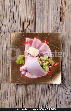 To use this stock image in your creative project, please select the size you need over to the right and click the "Add to Cart" button.
Your downloaded image will come with the Cutcaster watermark removed so don’t worry about the watermark you see on this page. Slices of ham stock photo, Slices of ham and salad greens - overhead by Digifoodstock