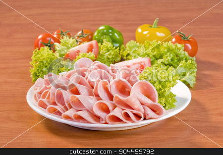 To use this stock image in your creative project, please select the size you need over to the right and click the "Add to Cart" button.
Your downloaded image will come with the Cutcaster watermark removed so don’t worry about the watermark you see on this page. Slices of Mortadella salami stock photo, Slices of Mortadella salami and fresh vegetable by Digifoodstock