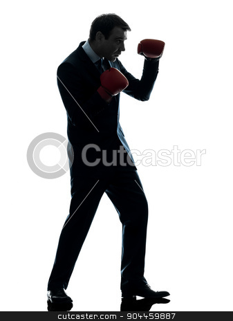 To use this stock image in your creative project, please select the size you need over to the right and click the "Add to Cart" button.
Your downloaded image will come with the Cutcaster watermark removed so don’t worry about the watermark you see on this page. business man boxer with boxing gloves silhouette stock photo, one businessman with boxing gloves in silhouette studio isolated on white background by Ishadow