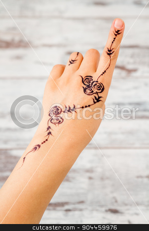 To use this stock image in your creative project, please select the size you need over to the right and click the "Add to Cart" button.
Your downloaded image will come with the Cutcaster watermark removed so don’t worry about the watermark you see on this page. Woman Hand Painted with Floral Figures Using Black Henna stock photo, Woman hand without nail polish painted with floral figures using black henna by OZMedia