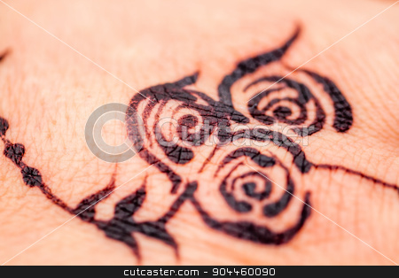 To use this stock image in your creative project, please select the size you need over to the right and click the "Add to Cart" button.
Your downloaded image will come with the Cutcaster watermark removed so don’t worry about the watermark you see on this page. Close up of a Flower Design Painted with Black Henna to the Skin stock photo, Close up of a flower design painted with black henna to the skin by OZMedia