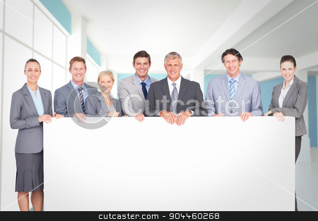 To use this stock image in your creative project, please select the size you need over to the right and click the "Add to Cart" button.
Your downloaded image will come with the Cutcaster watermark removed so don’t worry about the watermark you see on this page. Composite image of smiling business team holding poster stock photo, Smiling business team holding poster against modern blue and white room by Wavebreak Media