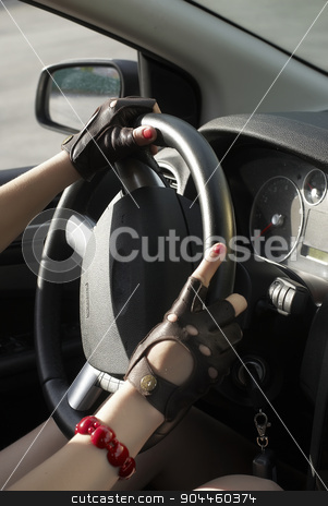 To use this stock image in your creative project, please select the size you need over to the right and click the "Add to Cart" button.
Your downloaded image will come with the Cutcaster watermark removed so don’t worry about the watermark you see on this page. Driving girl stock photo, Driving girl with hands on wheel steering by Aikon
