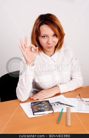 To use this stock image in your creative project, please select the size you need over to the right and click the "Add to Cart" button.
Your downloaded image will come with the Cutcaster watermark removed so don’t worry about the watermark you see on this page. business analyst woman with ok gesture stock photo, caucasian businesswoman sitting at desk in casual clothes. She is analyzing sales statistics and showing ok gesture by Aikon