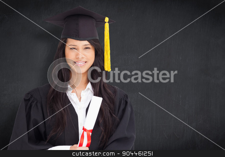 To use this stock image in your creative project, please select the size you need over to the right and click the "Add to Cart" button.
Your downloaded image will come with the Cutcaster watermark removed so don’t worry about the watermark you see on this page. Composite image of a smiling woman looking at the camera while d stock photo, A smiling woman looking at the camera while dressed in her graduation gown against blackboard by Wavebreak Media