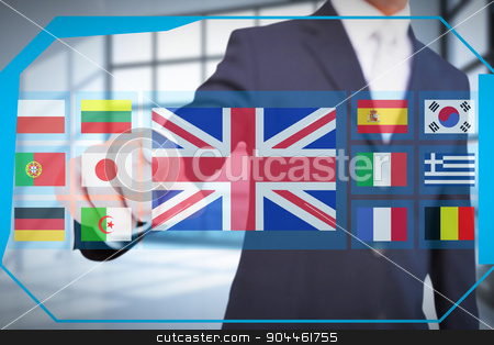 To use this stock image in your creative project, please select the size you need over to the right and click the "Add to Cart" button.
Your downloaded image will come with the Cutcaster watermark removed so don’t worry about the watermark you see on this page. Composite image of smiling businessman in suit pointing stock photo, Smiling businessman in suit pointing against room with large windows showing city by Wavebreak Media