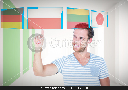 To use this stock image in your creative project, please select the size you need over to the right and click the "Add to Cart" button.
Your downloaded image will come with the Cutcaster watermark removed so don’t worry about the watermark you see on this page. Composite image of handsome man pointing at something stock photo, Handsome man pointing at something against modern white and green room with window by Wavebreak Media