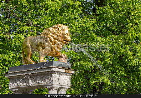 To use this stock image in your creative project, please select the size you need over to the right and click the "Add to Cart" button.
Your downloaded image will come with the Cutcaster watermark removed so don’t worry about the watermark you see on this page. Lion fountain stock photo, A golden lion gargoyles on a pedestal at the fountain by Bernd Kröger