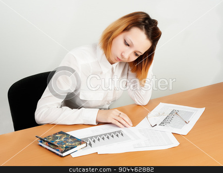 To use this stock image in your creative project, please select the size you need over to the right and click the "Add to Cart" button.
Your downloaded image will come with the Cutcaster watermark removed so don’t worry about the watermark you see on this page. business analyst woman working stock photo, caucasian businesswoman sitting at desk in casual clothes and analyzing sales statistics by Aikon