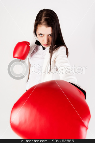 To use this stock image in your creative project, please select the size you need over to the right and click the "Add to Cart" button.
Your downloaded image will come with the Cutcaster watermark removed so don’t worry about the watermark you see on this page. young businesswoman in boxing gloves stock photo, Serious business lady with red gloves fighting against white background by Aikon