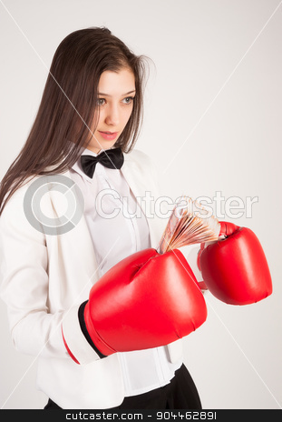 To use this stock image in your creative project, please select the size you need over to the right and click the "Add to Cart" button.
Your downloaded image will come with the Cutcaster watermark removed so don’t worry about the watermark you see on this page. young businesswoman in boxing gloves stock photo, Smiling business lady with red gloves holding cash at white background by Aikon