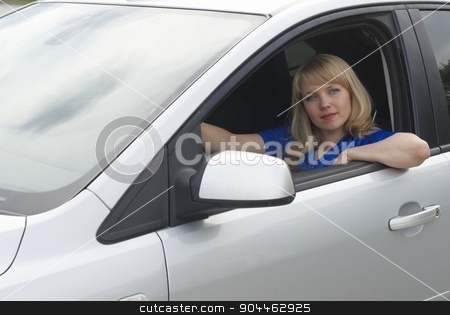To use this stock image in your creative project, please select the size you need over to the right and click the "Add to Cart" button.
Your downloaded image will come with the Cutcaster watermark removed so don’t worry about the watermark you see on this page. Young woman in car stock photo, Young woman sitting in a car and driving by Aikon