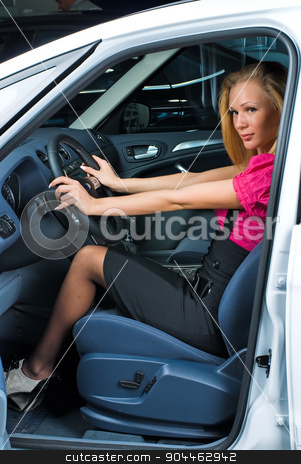 To use this stock image in your creative project, please select the size you need over to the right and click the "Add to Cart" button.
Your downloaded image will come with the Cutcaster watermark removed so don’t worry about the watermark you see on this page. Pretty woman - driver stock photo, Young attractive woman sits in car and ready to drive by Aikon