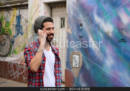 To use this stock image in your creative project, please select the size you need over to the right and click the "Add to Cart" button.
Your downloaded image will come with the Cutcaster watermark removed so don’t worry about the watermark you see on this page. Young man talking on the phone. stock photo, Handsome young man talking on the phone. Trendy and urban scene. by nicolas menijes
