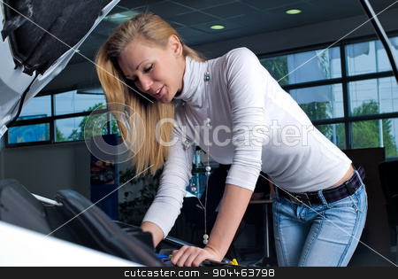 To use this stock image in your creative project, please select the size you need over to the right and click the "Add to Cart" button.
Your downloaded image will come with the Cutcaster watermark removed so don’t worry about the watermark you see on this page. Young woman at broken car stock photo, business woman over engine with a car breakdown by Aikon