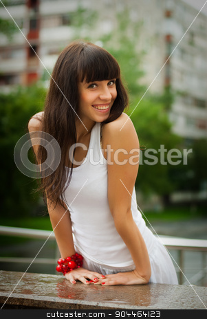 To use this stock image in your creative project, please select the size you need over to the right and click the "Add to Cart" button.
Your downloaded image will come with the Cutcaster watermark removed so don’t worry about the watermark you see on this page. Pretty smiling girl with red beads stock photo, Beautiful smiling girl with red beads at city background by Aikon