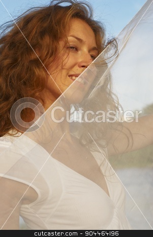 To use this stock image in your creative project, please select the size you need over to the right and click the "Add to Cart" button.
Your downloaded image will come with the Cutcaster watermark removed so don’t worry about the watermark you see on this page. Young pretty woman with white scarf stock photo, Young attractive woman in white dress and holding white scarf on beach by Aikon