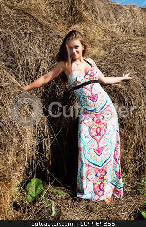 To use this stock image in your creative project, please select the size you need over to the right and click the "Add to Cart" button.
Your downloaded image will come with the Cutcaster watermark removed so don’t worry about the watermark you see on this page. Young beautiful woman on hay stock photo, Portrait of young attractive brunette woman standing near hay stack by Aikon