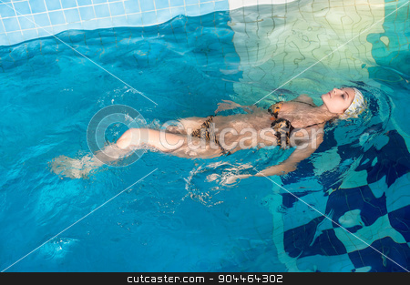 To use this stock image in your creative project, please select the size you need over to the right and click the "Add to Cart" button.
Your downloaded image will come with the Cutcaster watermark removed so don’t worry about the watermark you see on this page. Pretty girl in swimming pool stock photo, Young beautiful sexy woman relaxing in swimming pool by Aikon