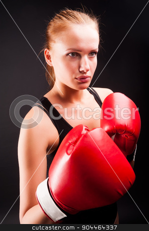 To use this stock image in your creative project, please select the size you need over to the right and click the "Add to Cart" button.
Your downloaded image will come with the Cutcaster watermark removed so don’t worry about the watermark you see on this page. Pretty girl with boxing gloves stock photo, Young attractive woman with boxing gloves at black background by Aikon