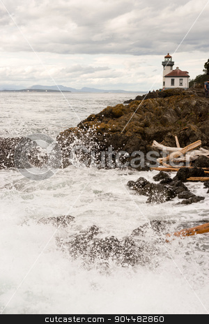To use this stock image in your creative project, please select the size you need over to the right and click the "Add to Cart" button.
Your downloaded image will come with the Cutcaster watermark removed so don’t worry about the watermark you see on this page. Waves Crash onto Sharp Rocks Jetty San Juan Island Lighthouse stock photo, Canada can be seen across the straight from San Juan Island by Christopher Boswell