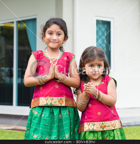 To use this stock image in your creative project, please select the size you need over to the right and click the "Add to Cart" button.
Your downloaded image will come with the Cutcaster watermark removed so don’t worry about the watermark you see on this page. Cute Indian girls in sari greeting stock photo, Cute Indian girls dressed in sari with folded hands representing traditional Indian greeting, standing outside their new house celebrating diwali, festival of lights. by szefei