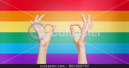 To use this stock image in your creative project, please select the size you need over to the right and click the "Add to Cart" button.
Your downloaded image will come with the Cutcaster watermark removed so don’t worry about the watermark you see on this page. hands showing ok sign over rainbow background stock photo, people, gay pride, gesture and homosexual concept - human hands showing ok sign over rainbow flag stripes background by Syda Productions