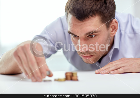 To use this stock image in your creative project, please select the size you need over to the right and click the "Add to Cart" button.
Your downloaded image will come with the Cutcaster watermark removed so don’t worry about the watermark you see on this page. businessman with coins at office stock photo, business, people, finances and money saving concept - businessman putting coins into piles at office by Syda Productions