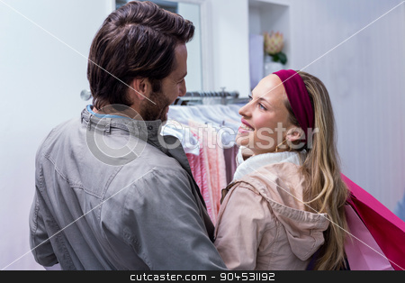 To use this stock image in your creative project, please select the size you need over to the right and click the "Add to Cart" button.
Your downloaded image will come with the Cutcaster watermark removed so don’t worry about the watermark you see on this page. Smiling couple with shopping bags looking at each other stock photo, Smiling couple with shopping bags looking at each other in clothing store by Wavebreak Media