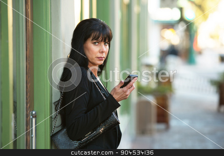 To use this stock image in your creative project, please select the size you need over to the right and click the "Add to Cart" button.
Your downloaded image will come with the Cutcaster watermark removed so don’t worry about the watermark you see on this page. Beautiful Woman with her Cellphone stock photo, A beautiful woman holding cellphone on a downtown street by Scott Griessel