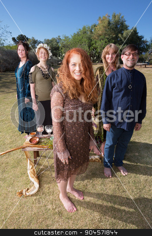 To use this stock image in your creative project, please select the size you need over to the right and click the "Add to Cart" button.
Your downloaded image will come with the Cutcaster watermark removed so don’t worry about the watermark you see on this page. Barefoot Pagans Outdoors stock photo, Group of barefoot pagans in ritual standing outdoors with objects by Scott Griessel