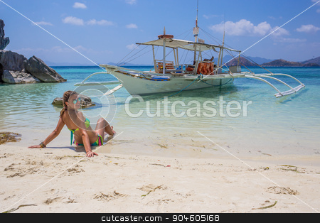 To use this stock image in your creative project, please select the size you need over to the right and click the "Add to Cart" button.
Your downloaded image will come with the Cutcaster watermark removed so don’t worry about the watermark you see on this page. Young woman reaxing on the beach at exotic resort stock photo, Young Latino woman reaxing on the beach at exotic resort by Vassiliy Kochetkov