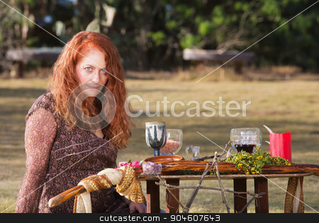 To use this stock image in your creative project, please select the size you need over to the right and click the "Add to Cart" button.
Your downloaded image will come with the Cutcaster watermark removed so don’t worry about the watermark you see on this page. Female Wicca Practioner stock photo, Female Wicca priestess with staff and goblets on altar by Scott Griessel
