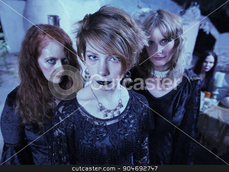 To use this stock image in your creative project, please select the size you need over to the right and click the "Add to Cart" button.
Your downloaded image will come with the Cutcaster watermark removed so don’t worry about the watermark you see on this page. Serious Pagan Women in Black stock photo, Trio of female adults in Wicca ceremony outdoors by Scott Griessel