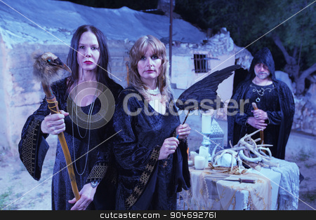 To use this stock image in your creative project, please select the size you need over to the right and click the "Add to Cart" button.
Your downloaded image will come with the Cutcaster watermark removed so don’t worry about the watermark you see on this page. Witches with Fetishes in Ritual stock photo, Group of witches with fetishes in worship ritual by Scott Griessel