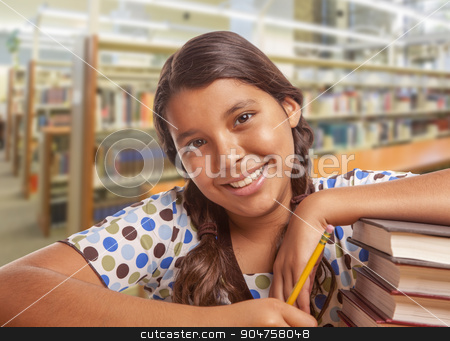 To use this stock image in your creative project, please select the size you need over to the right and click the "Add to Cart" button.
Your downloaded image will come with the Cutcaster watermark removed so don’t worry about the watermark you see on this page. Hispanic Girl Student Studying in Library stock photo, Happy Hispanic Girl Student with Pencil and Books Studying in Library. by Andy Dean