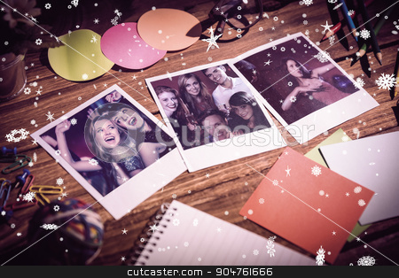 To use this stock image in your creative project, please select the size you need over to the right and click the "Add to Cart" button.
Your downloaded image will come with the Cutcaster watermark removed so don’t worry about the watermark you see on this page. Composite image of high angle view of office supplies with blank stock photo, High angle view of office supplies with blank instant photos against happy friends having fun together by Wavebreak Media