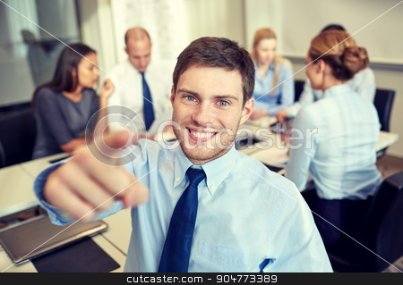 To use this stock image in your creative project, please select the size you need over to the right and click the "Add to Cart" button.
Your downloaded image will come with the Cutcaster watermark removed so don’t worry about the watermark you see on this page. group of smiling businesspeople meeting in office stock photo, business, people, gesture and teamwork concept - smiling businessman pointing finger to you with group of businesspeople meeting in office by Syda Productions